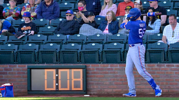 exas Rangers catcher Sam Huff waits in the batting circle as the pitch timer winds down.